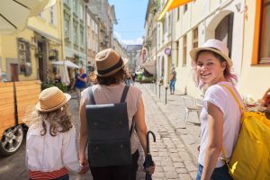 People enjoying the views in the baroque Getreidegasse in salzburg on a sightseeing trip
