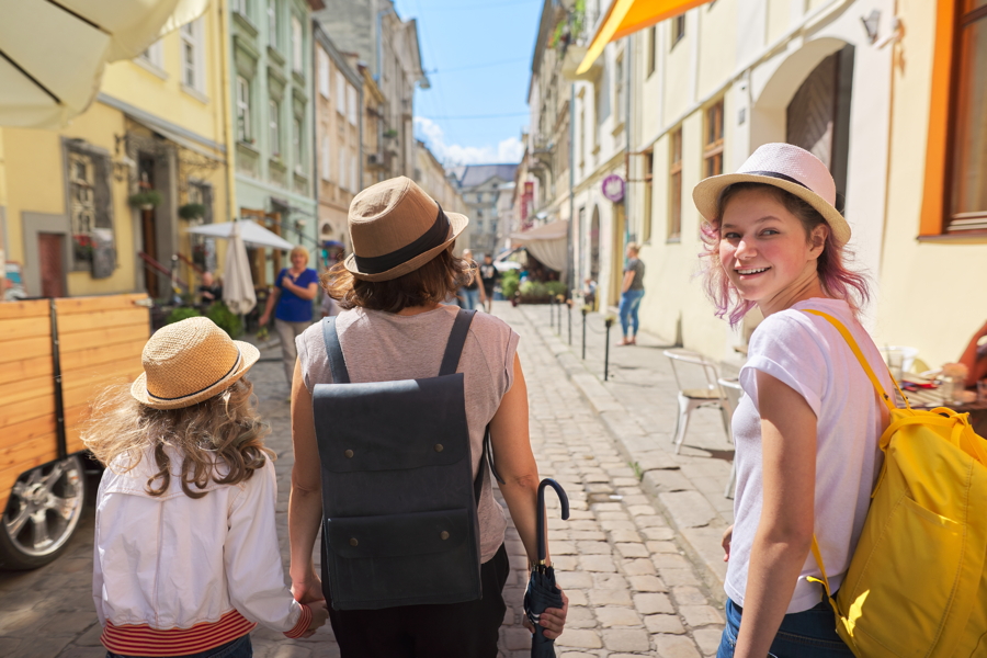 People enjoying the views in the baroque Getreidegasse in salzburg on a sightseeing trip
